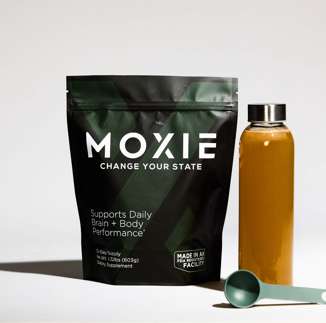 Photo of Moxie packaging with bottle of beverage and scoop - physical and mental performance